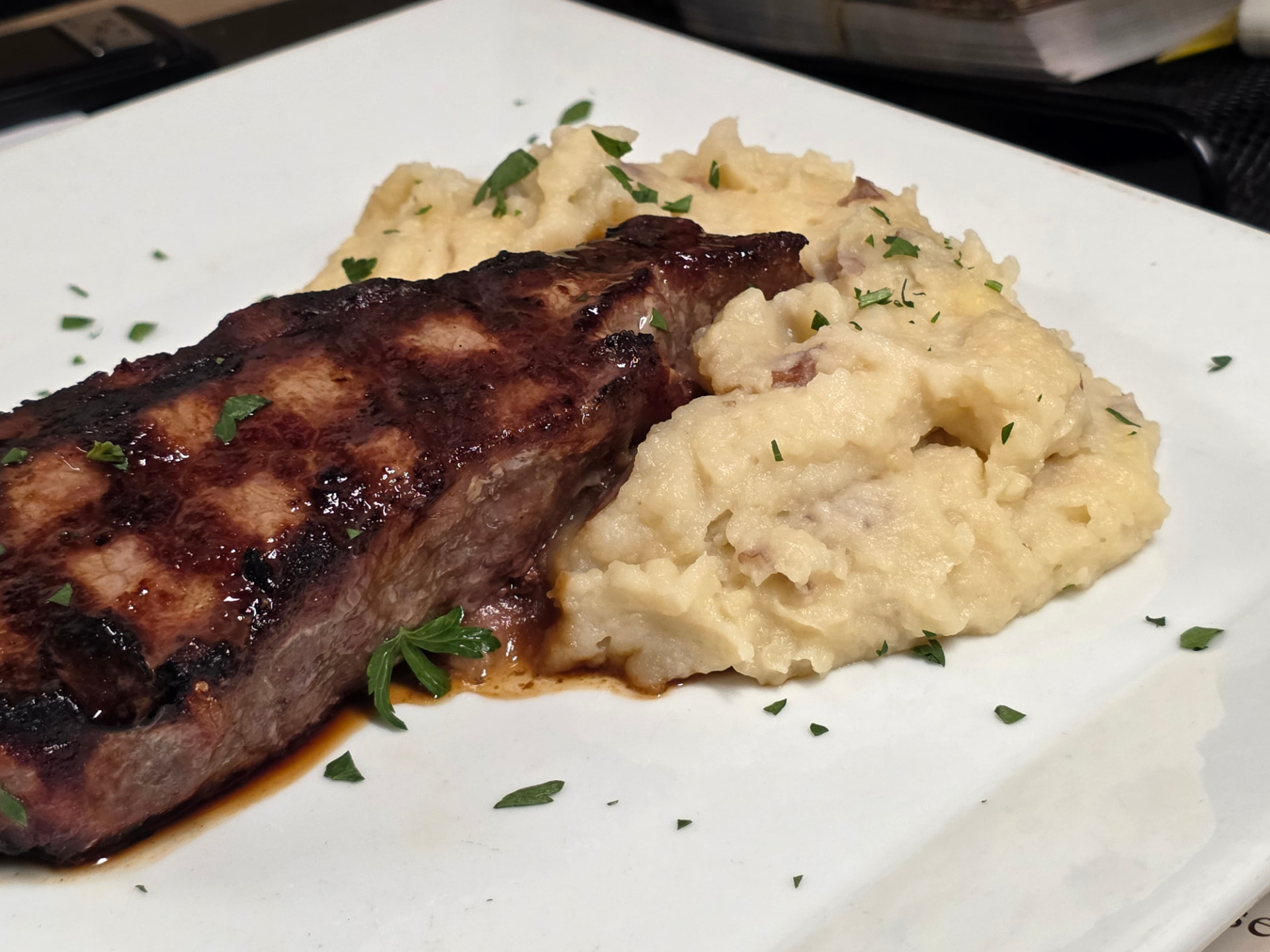 Grilled Black Angus NY sirloin steak with mashed potatoes